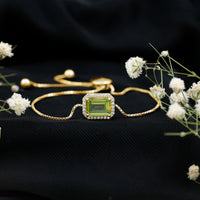 Emerald cut peridot and diamond bolo chain bracelet from Rosec Jewels with 1.8 carats of vibrant green peridot stones.