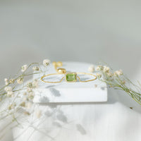 Emerald cut peridot and diamond bolo chain bracelet featuring 1.8 carats of gemstones, designed by Rosec Jewels.
