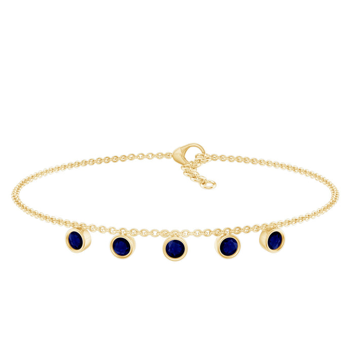 Bezel set blue sapphire charm bracelet by Rosec Jewels featuring a row of sparkling blue sapphires on a delicate bracelet chain.