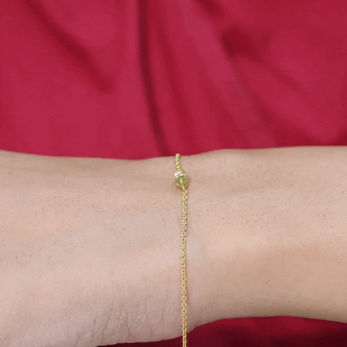 Genuine 0.74 carat marquise cut peridot solitaire chain bracelet by Rosec Jewels, featuring yellow gold links and sparkling gemstones.