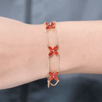 Marquise cut fire opal flower chain bracelet by Rosec Jewels with vibrant orange gemstones and delicate floral design.