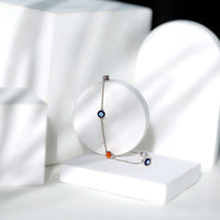 Bezel set fire opal evil eye station bracelet for women by Rosec Jewels, featuring colorful gemstone beads and silver-toned accents.