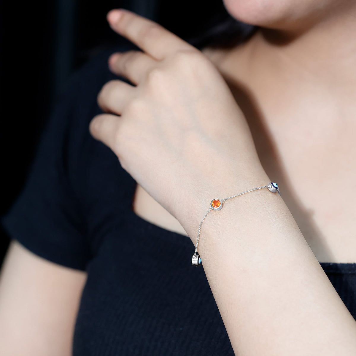 Bezel set fire opal evil eye station bracelet for women by Rosec Jewels, featuring colorful gemstone beads and protective evil eye charms.