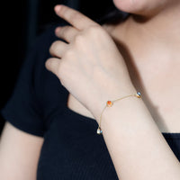 Bezel set fire opal evil eye station bracelet for women by Rosec Jewels, featuring colorful gemstones and protective design.