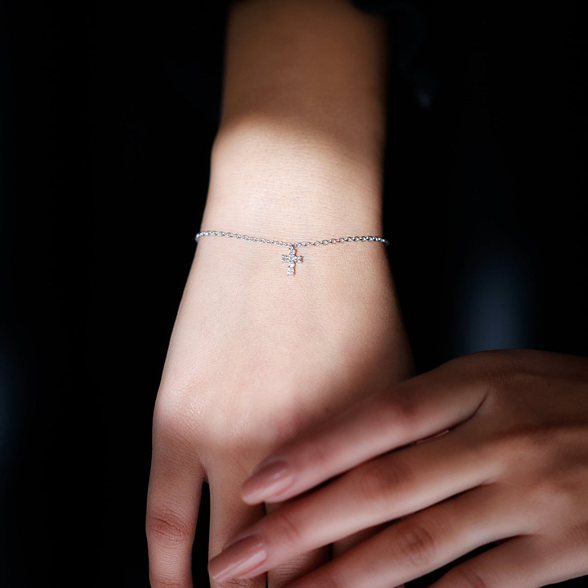 Rosec Jewels certified diamond cross chain bracelet with sparkling diamond accents on a delicate silver bracelet.