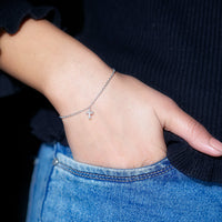 Rosec Jewels certified diamond cross chain bracelet with sparkling diamonds on a delicate gold bracelet.