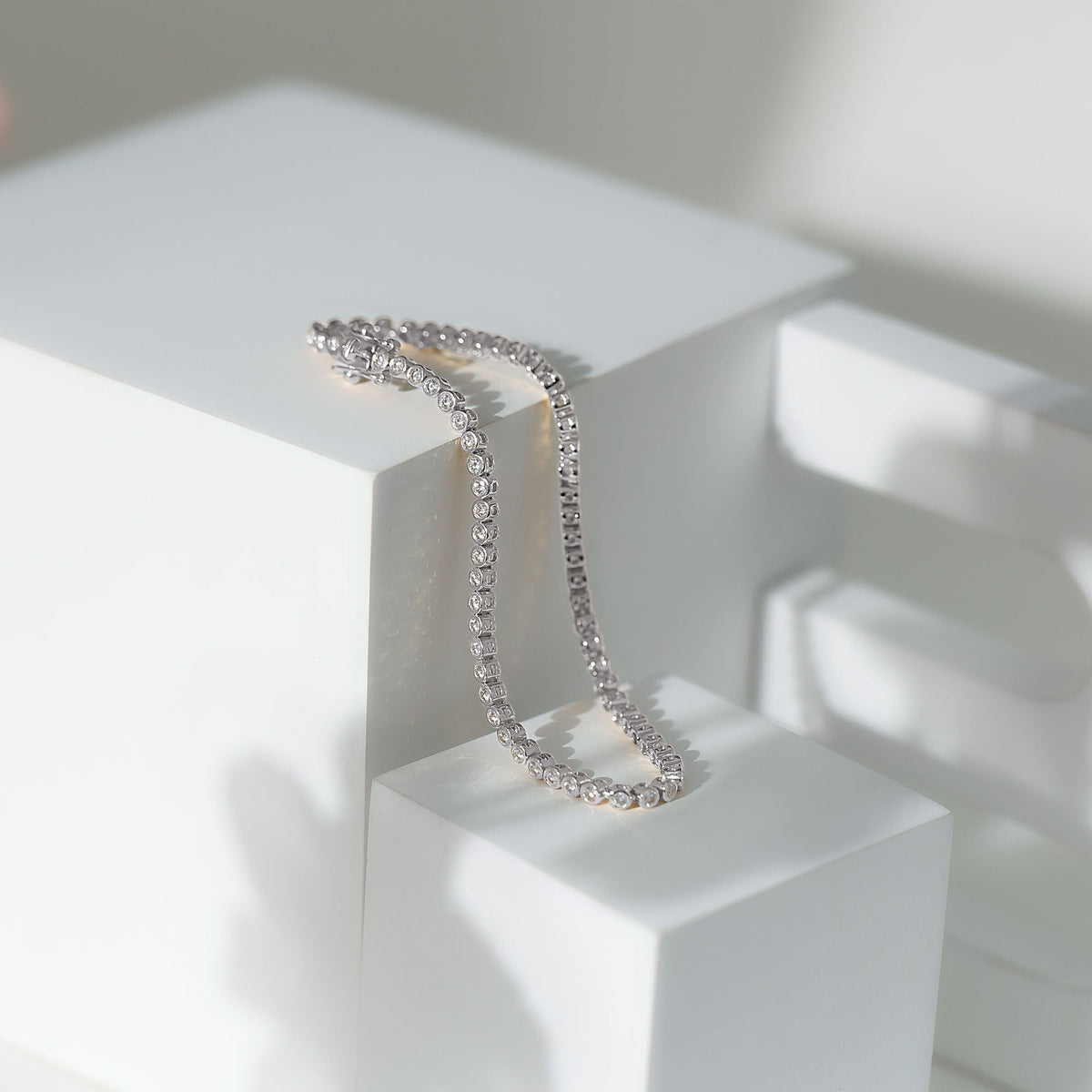 Certified Moissanite wedding tennis bracelet by Rosec Jewels with sparkling gemstones on a delicate silver chain.