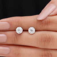Rosec Jewels 1 CT Zircon Classic Halo Stud Earrings, sparkling silver earrings with round zircon stones, in a close-up view.