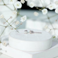 Brilliant cut diamond stud earrings in prong setting by Rosec Jewels, showcasing sparkling diamonds on a sleek metal backing.
