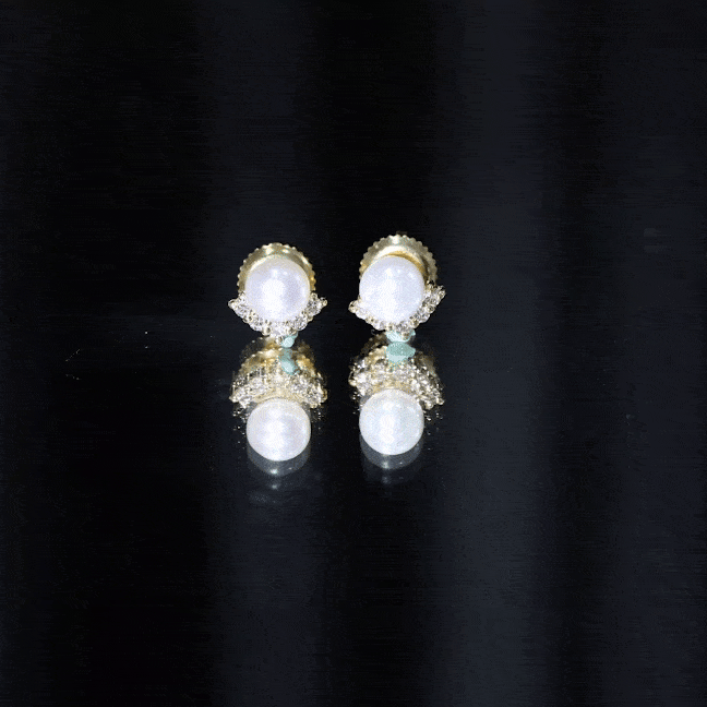 Rosec Jewels modern stud earrings featuring freshwater pearl and diamond accents on a sleek design.