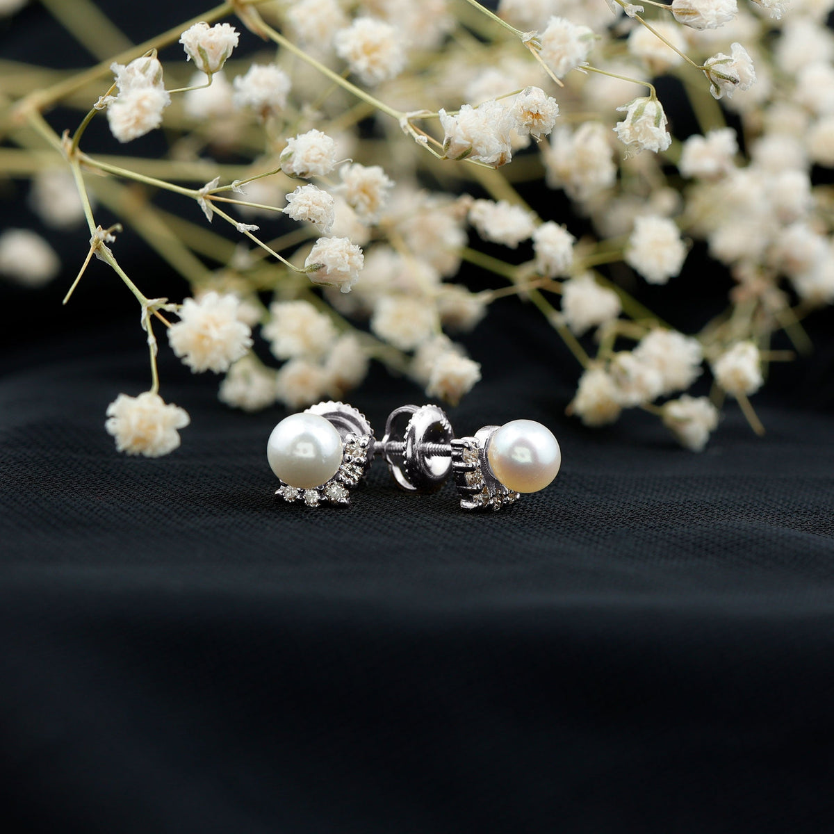 Rosec Jewels modern stud earrings with freshwater pearl and diamond, showcasing elegant jewelry design.