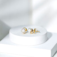 Rosec Jewels modern stud earrings featuring freshwater pearl and diamond accents, elegant jewelry for sophisticated style.