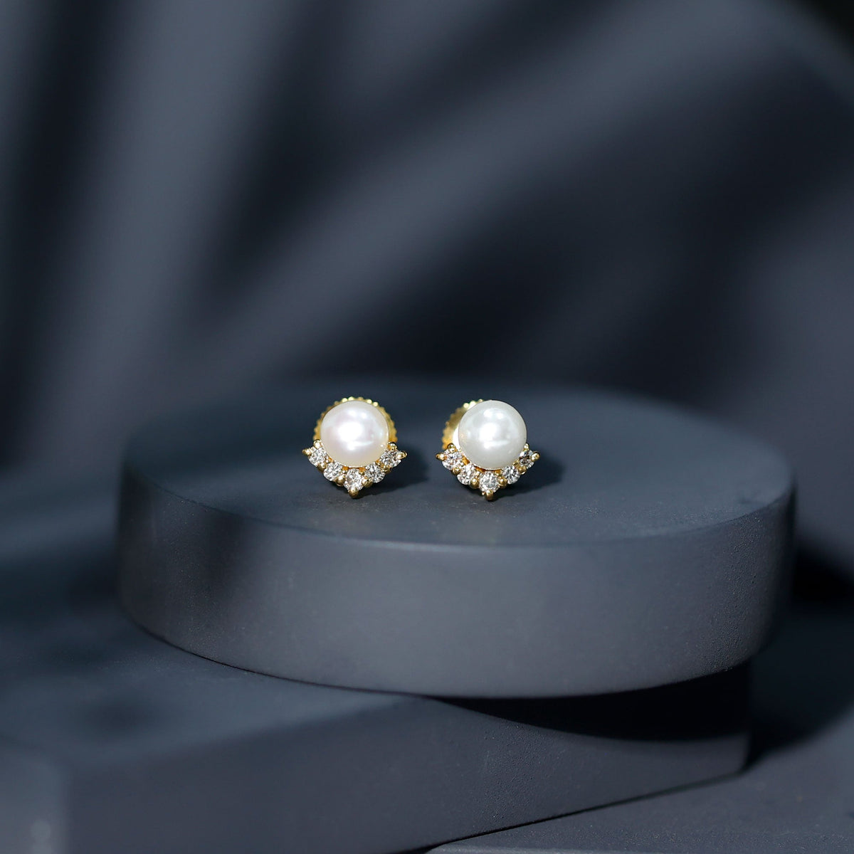 Rosec Jewels modern stud earrings featuring freshwater pearls and diamonds, showcasing elegant jewelry design.