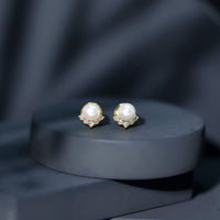 Rosec Jewels modern stud earrings featuring freshwater pearls and diamonds, showcasing elegant jewelry design.
