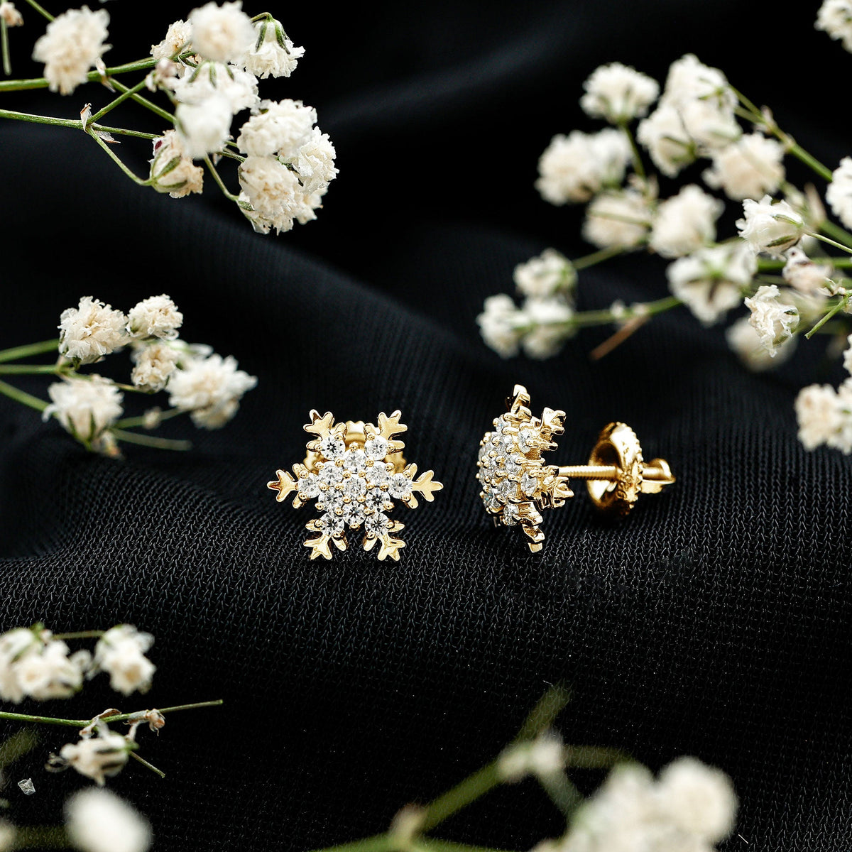 Rosec Jewels certified moissanite winter snowflake stud earrings with sparkling snowflake design and silver-tone setting.