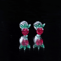 Yellow strawberry earrings by Rosec Jewels featuring lab-grown ruby and emerald accents, showcasing a playful and colorful jewelry design.