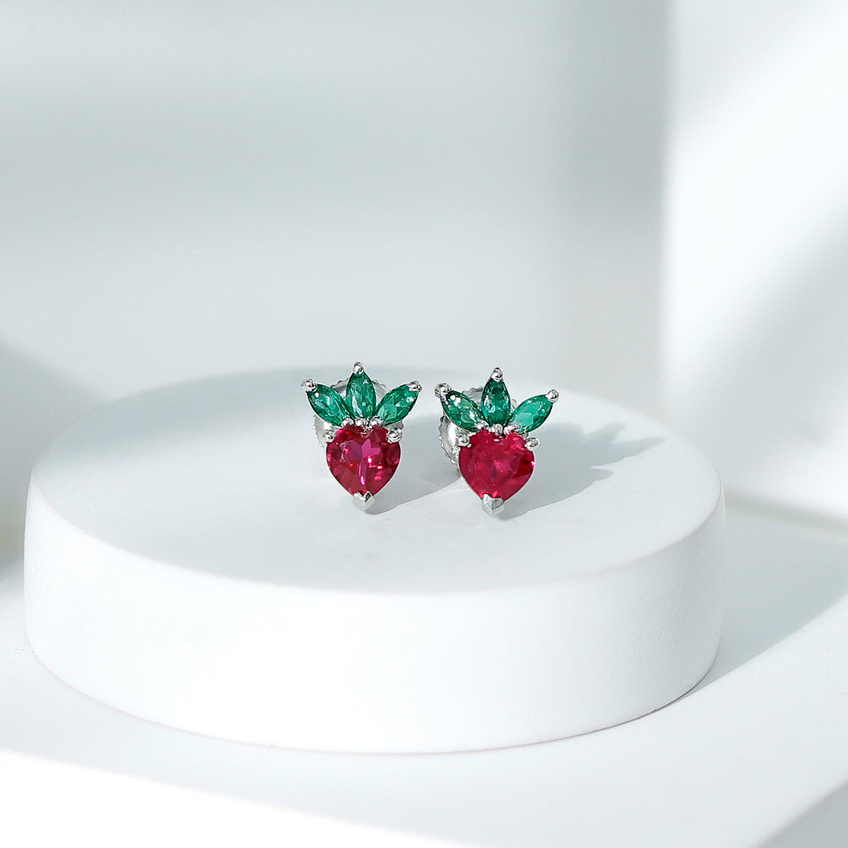 Rosec Jewels strawberry earrings with lab-grown ruby and emerald, featuring detailed gemstone designs and gold-tone metal.