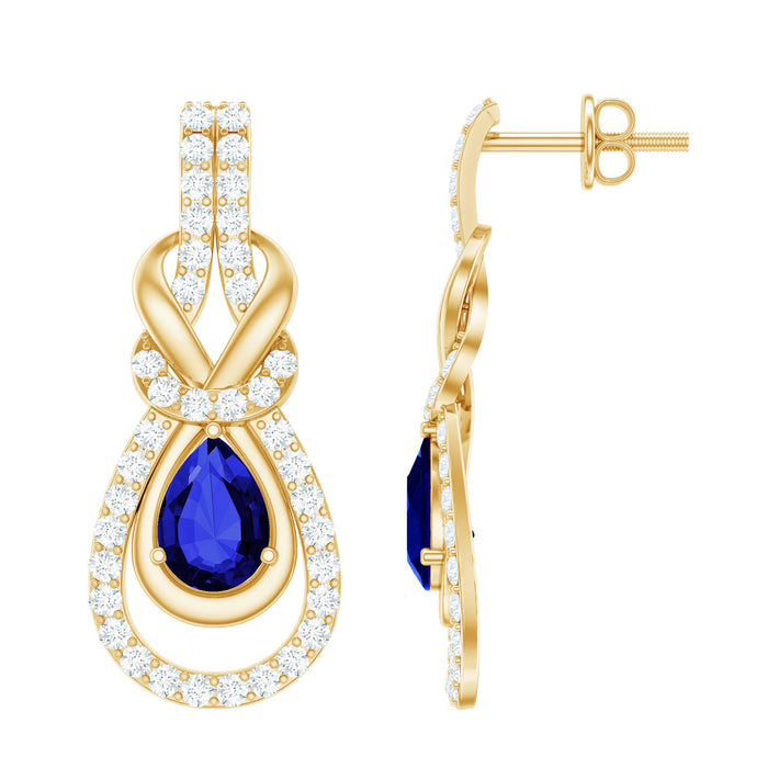 Lab grown blue sapphire and diamond wedding earrings by Rosec Jewels, featuring elegant gemstone and earring setting.