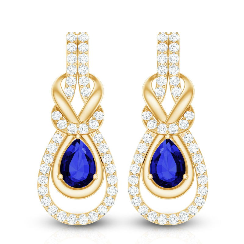 Lab-grown blue sapphire and diamond wedding earrings by Rosec Jewels featuring elegant gemstone settings and intricate design details.