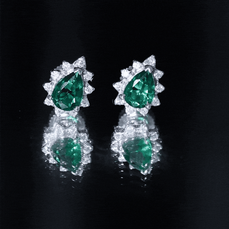 Lab emerald stud earrings with 1.4 carats and moissanite halo by Rosec Jewels, featuring sparkling green stones and elegant design.