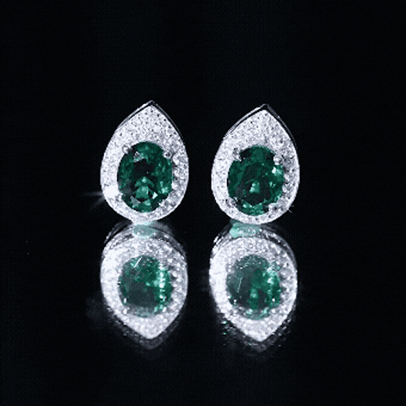 Elegant 2.5 carat lab-grown emerald teardrop stud earrings with moissanite halo by Rosec Jewels, showcasing sparkling gemstone details.