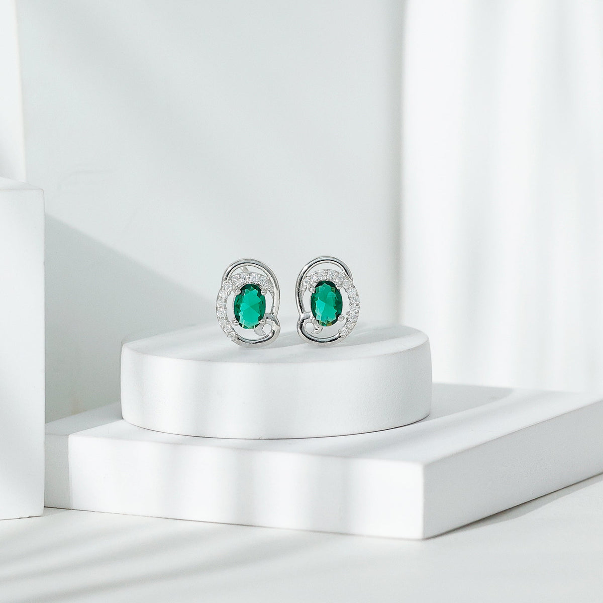 Oval Shaped 1.7 Carat Lab Grown Emerald Designer Earrings in Sterling Silver