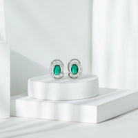 Oval Shaped 1.7 Carat Lab Grown Emerald Designer Earrings in Sterling Silver