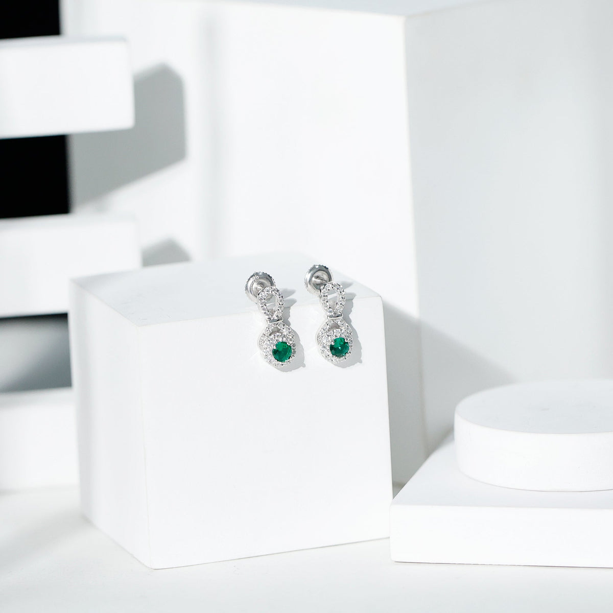 Half Carat Lab Grown Emerald Infinity Stud Earrings with Moissanite