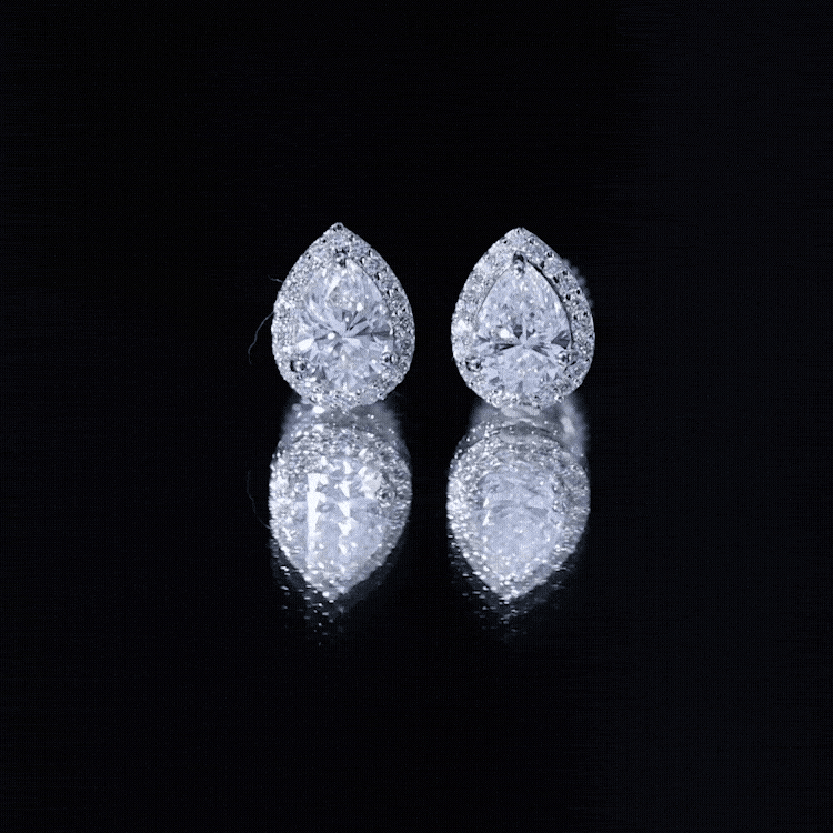 Yellow lab-grown diamond teardrop stud earrings by Rosec Jewels with 1.3 carats, showcasing sparkling gemstone details.