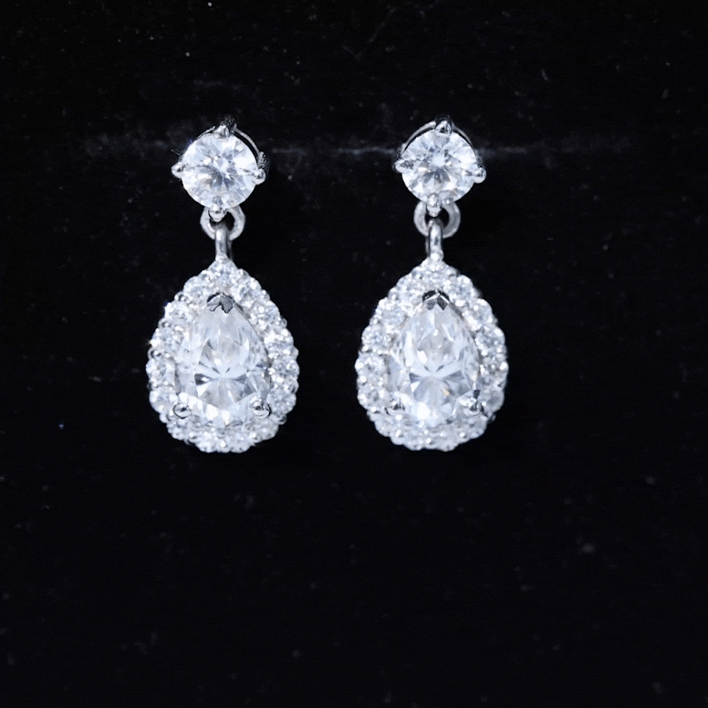Yellow pear-shaped diamond bridal drop earrings by Rosec Jewels, featuring elegant 5x7mm diamond earrings with a sophisticated design.