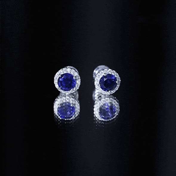 Certified 2 Carat lab-grown blue sapphire stud earrings with moissanite halo, featuring white gold setting and intricate design.