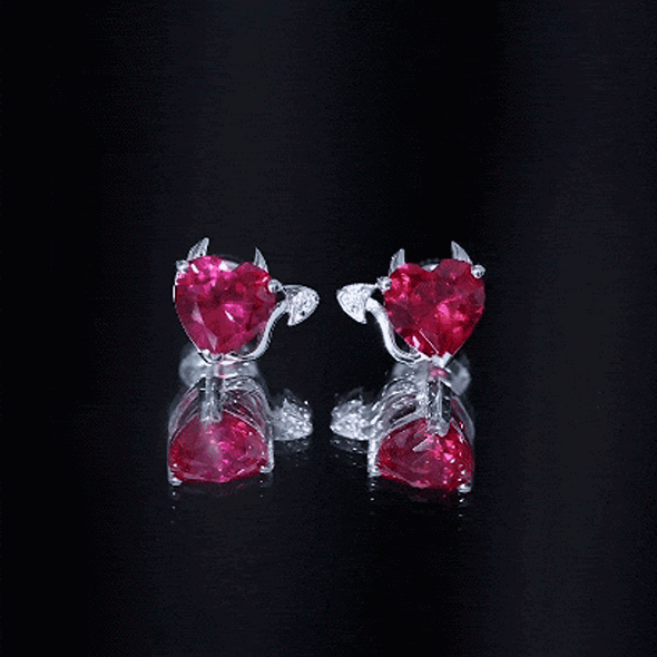 Certified 4 Carat Lab Grown Ruby Devil Heart Stud Earrings by Rosec Jewels featuring heart-shaped red rubies and silver settings.