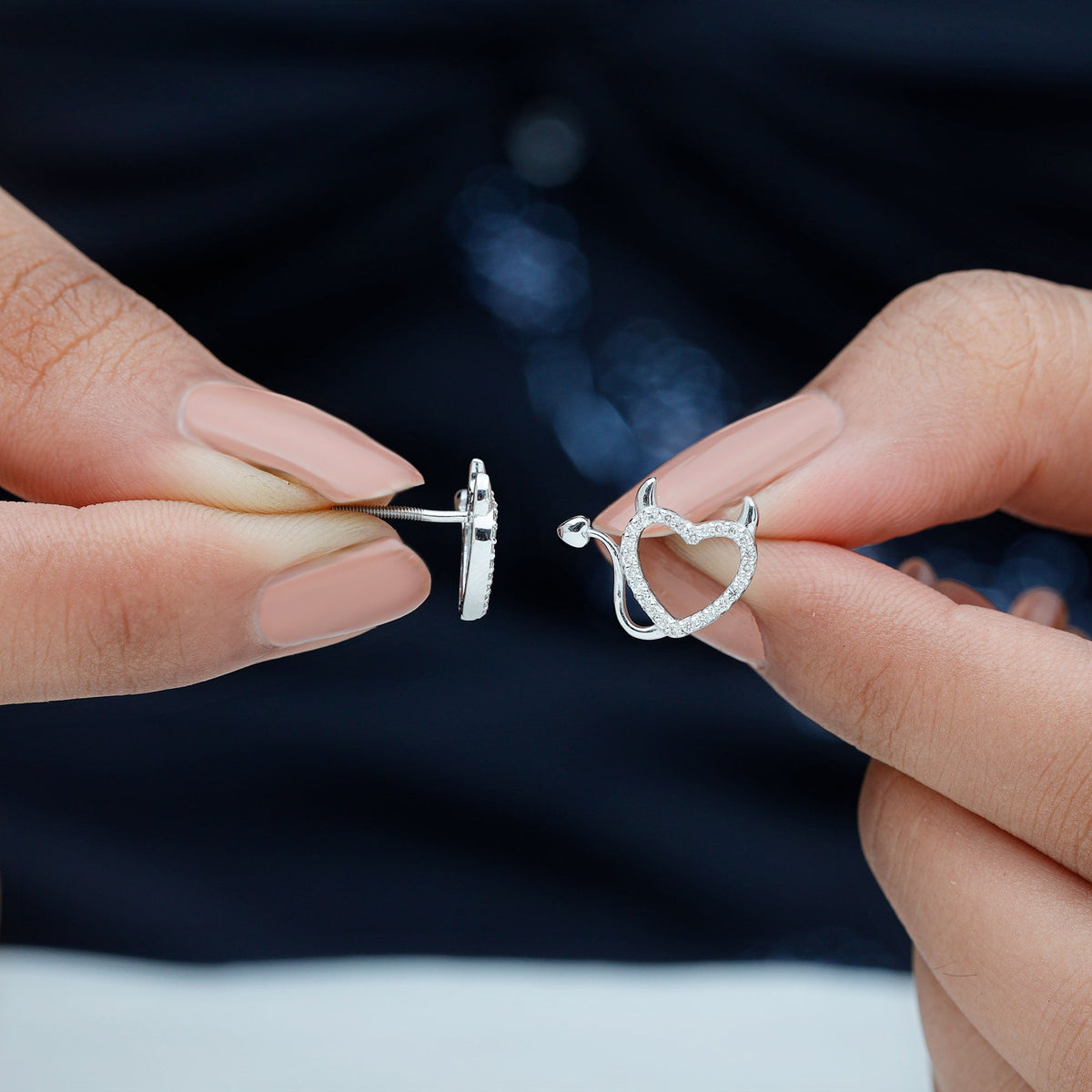 Rosec Jewels round diamond devil heart earrings with sparkling diamonds and intricate heart-shaped design.