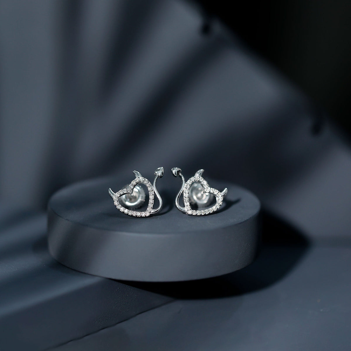Rosec Jewels round diamond devil heart earrings with sparkling diamonds and intricate heart-shaped design.