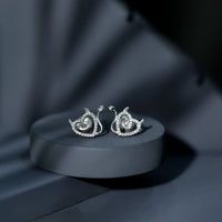 Rosec Jewels round diamond devil heart earrings with sparkling diamonds and intricate heart-shaped design.