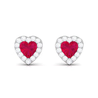 Heart-shaped ruby stud earrings with diamond halo from Rosec Jewels, featuring sparkling gemstones and elegant design.