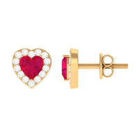 Heart-shaped ruby stud earrings with diamond halo from Rosec Jewels featuring sparkling gemstones and elegant jewelry design.