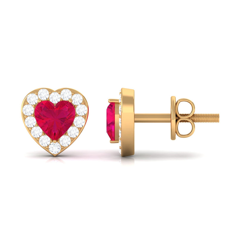 Heart-shaped ruby stud earrings with diamond halo from Rosec Jewels, featuring vibrant red rubies and sparkling diamond accents.