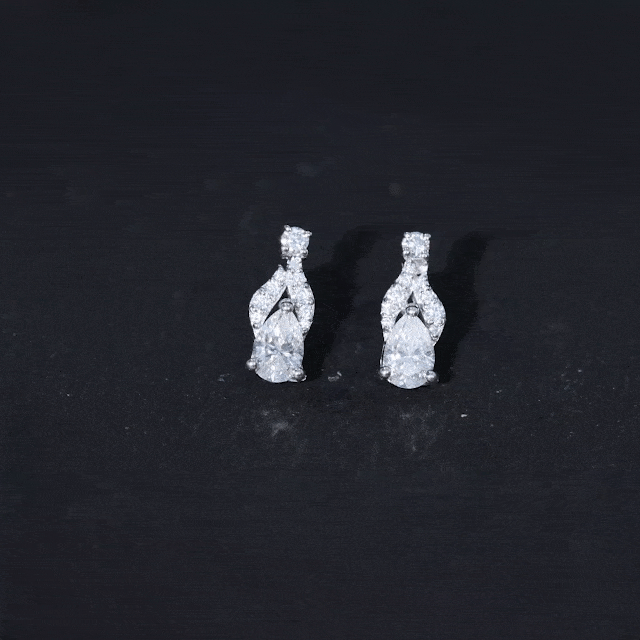 Yellow lab grown diamond teardrop stud earrings from Rosec Jewels with sparkling yellow diamonds and silver settings.
