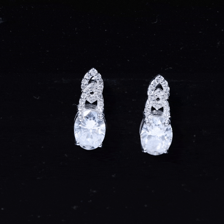 Rosec Jewels 6x8 mm oval lab-grown diamond designer stud earrings with yellow gold setting, showcasing elegant sparkle and craftsmanship.