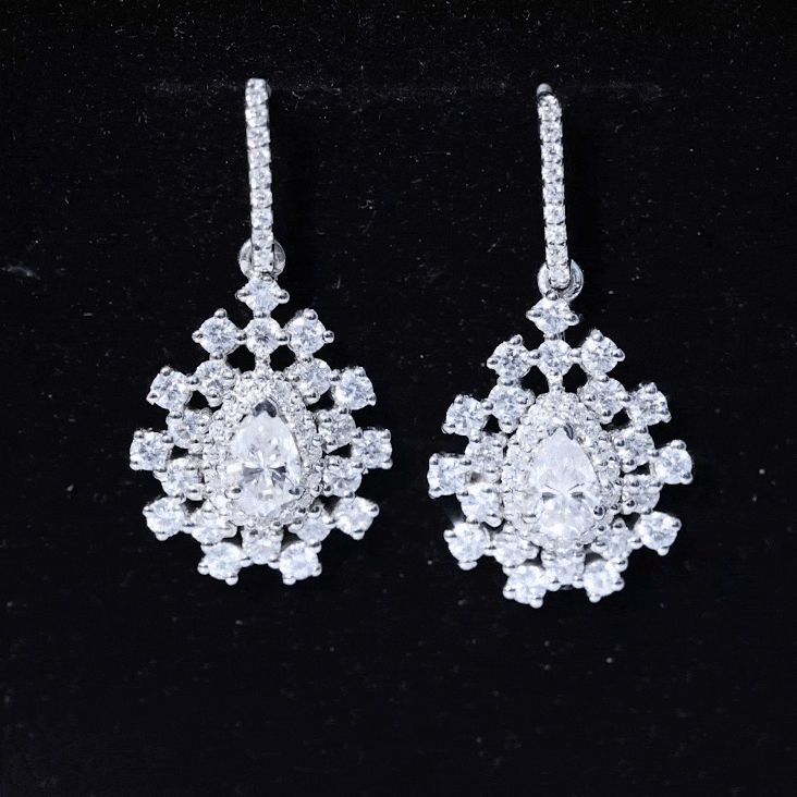 Yellow pear-shaped lab-grown diamond bridal drop earrings by Rosec Jewels with elegant design and sparkling gemstones.