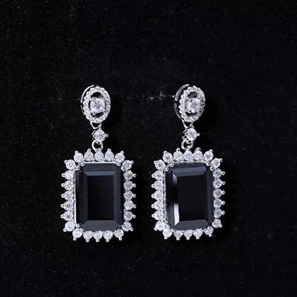 Elegant 18 carat black diamond statement earrings in silver with emerald cut lab-grown stones by Rosec Jewels.
