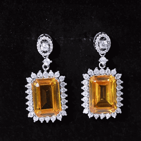 Lab-grown yellow sapphire emerald cut earrings in silver with AAAA quality from Rosec Jewels, showcasing elegant jewelry design