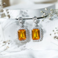 AAAA Quality 18 Carat Lab Grown Yellow Sapphire Emerald Cut Earrings in Silver