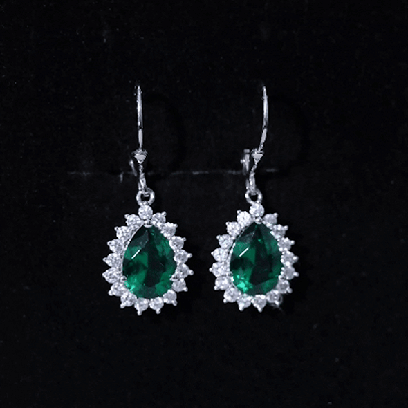 Sterling silver hoop earrings with lab-grown emerald drop accents by Rosec Jewels, showcasing a sparkling, elegant design