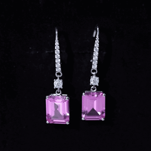 Lab grown pink sapphire bridal earrings in silver with 5.5 carats, featuring elegant gemstone settings and intricate silver detailing.