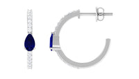 Pear-shaped blue sapphire and diamond hoop earrings by Rosec Jewels featuring a elegant design and sparkling gemstones.