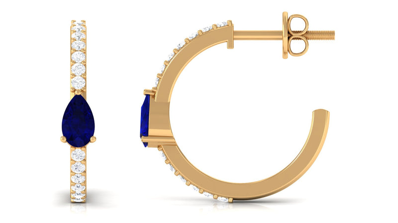 Pear-shaped blue sapphire and diamond hoop earrings by Rosec Jewels featuring elegant gold settings and intricate design details.