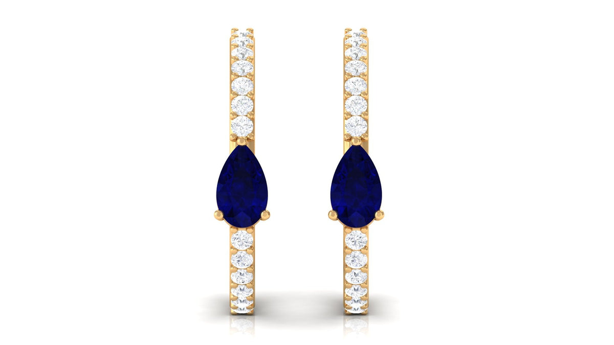 Pear-shaped blue sapphire and diamond hoop earrings by Rosec Jewels featuring elegant gemstone settings and a classic hoop design.