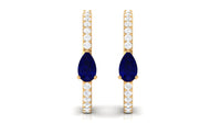Pear-shaped blue sapphire and diamond hoop earrings by Rosec Jewels featuring elegant gemstone settings and a classic hoop design.